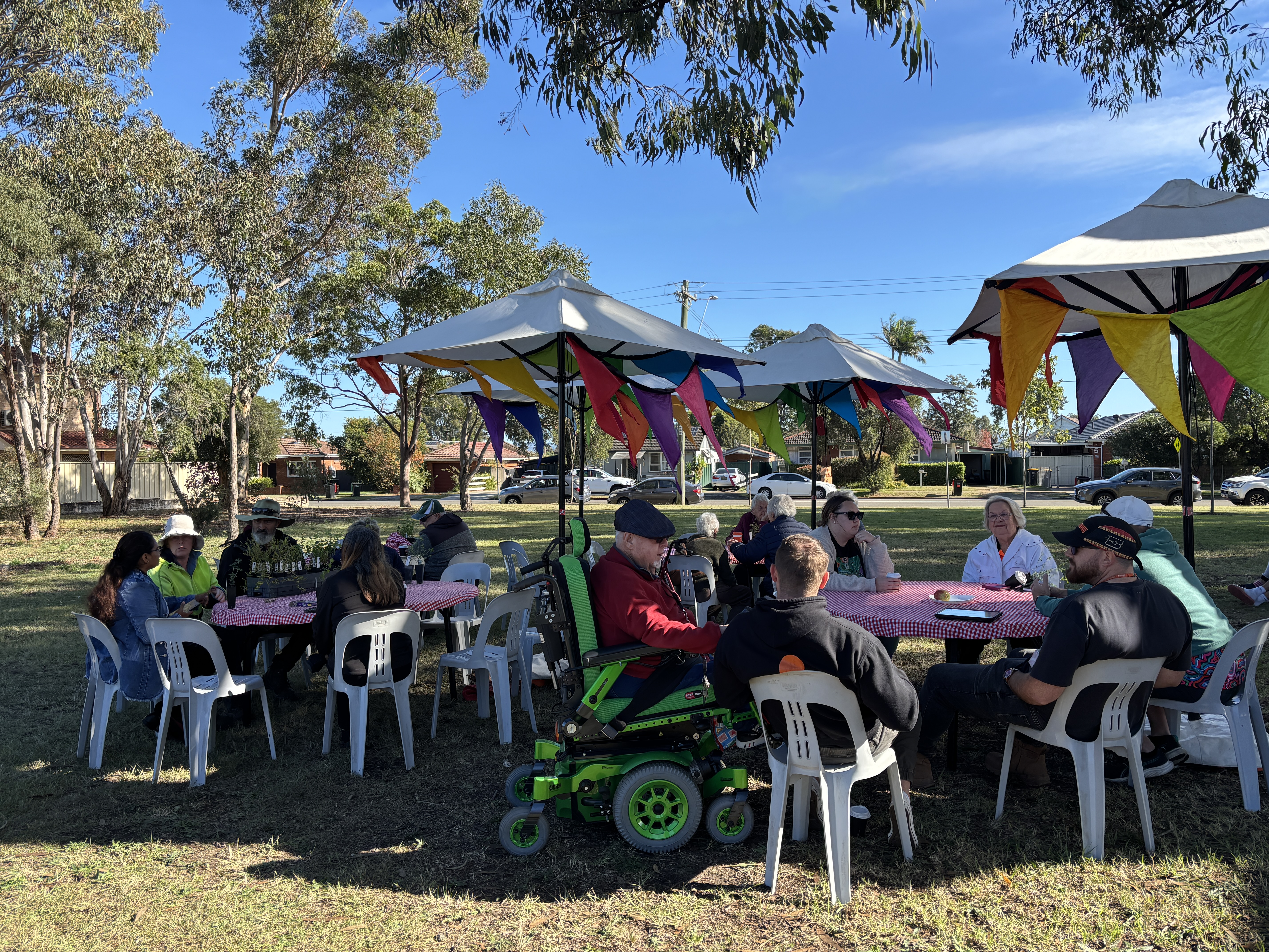 Group of people at outdoor cafe in park